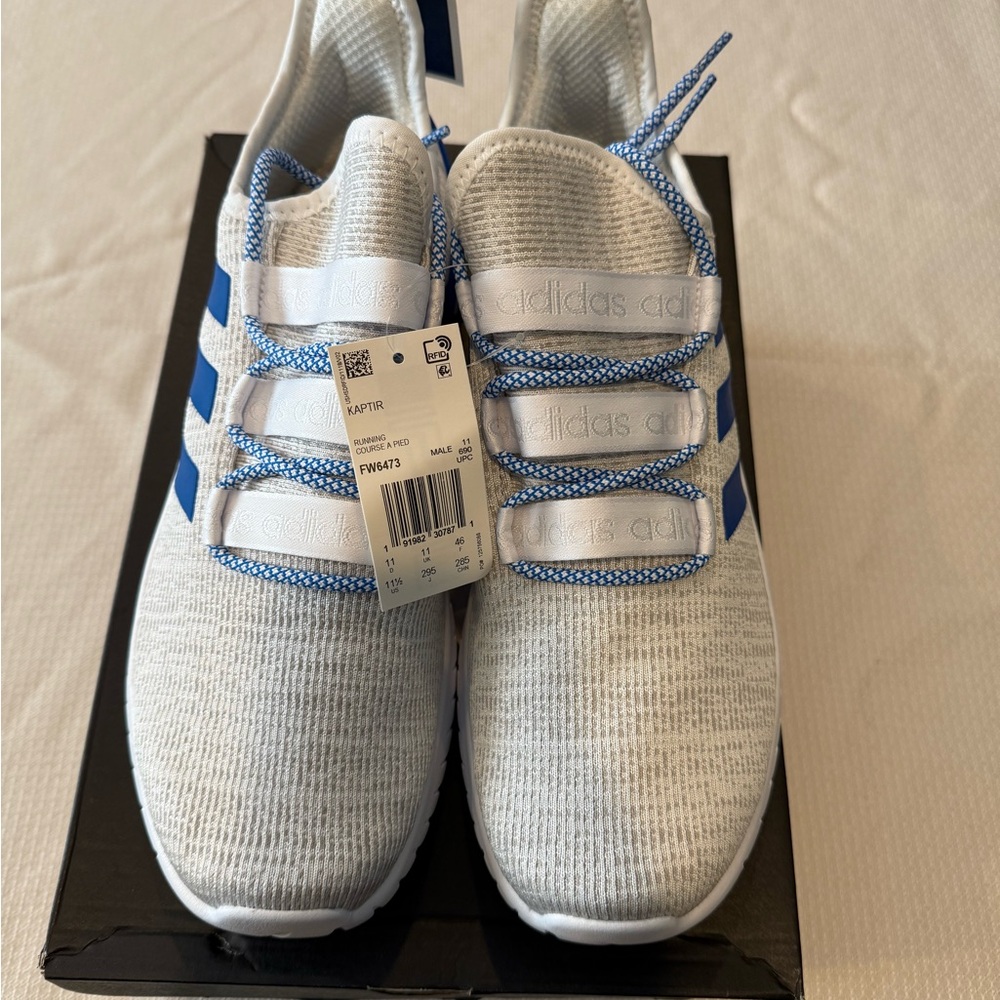 Brand new men’s, Adidas Kaptir sneakers, color white and blue size 11.5.